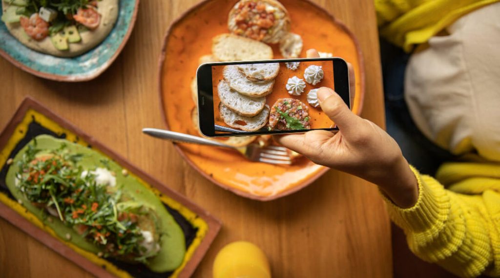 Taking a mobile photo of the menu in a tapas restaurant